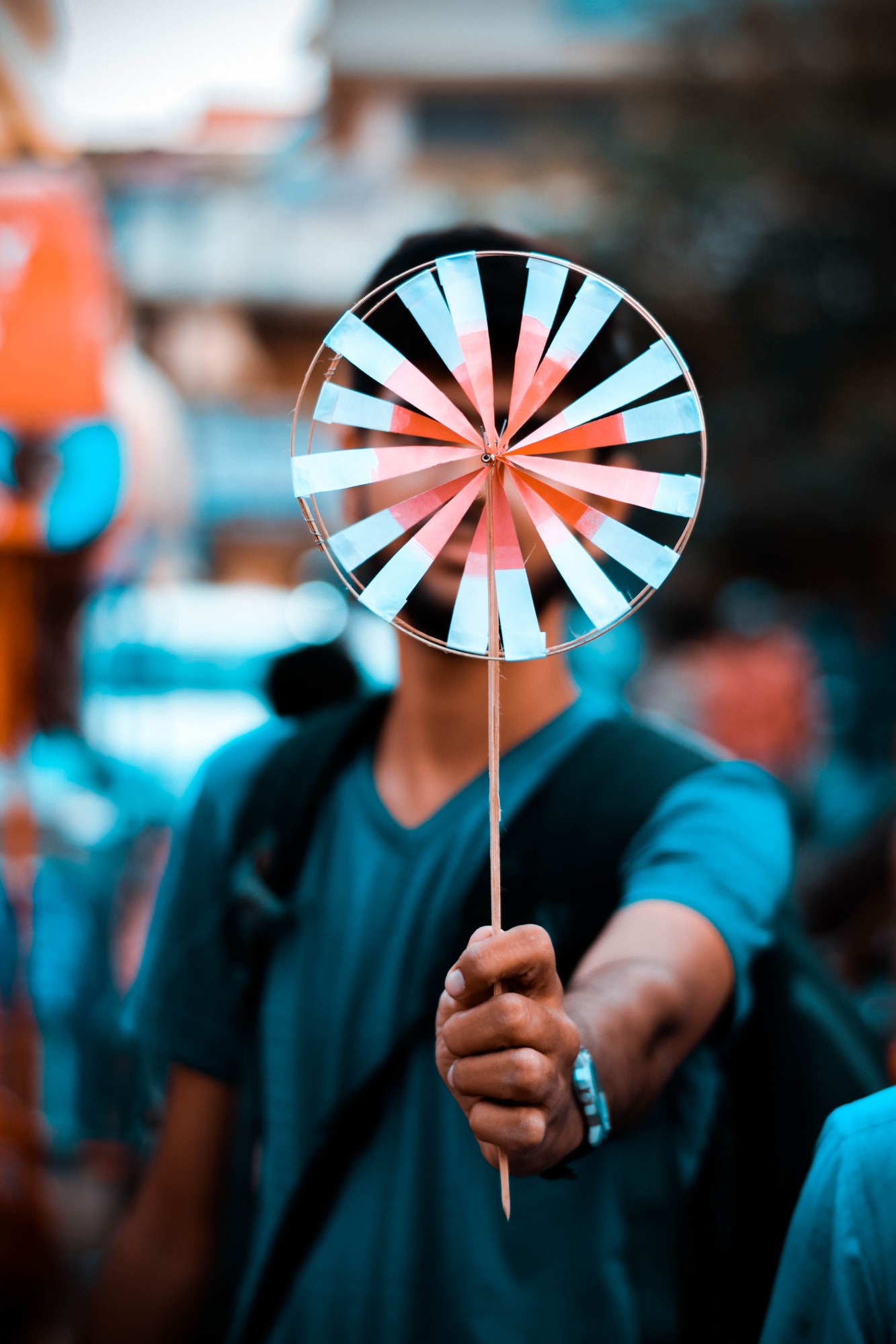 Hand holding a paper pinwheel, Patna